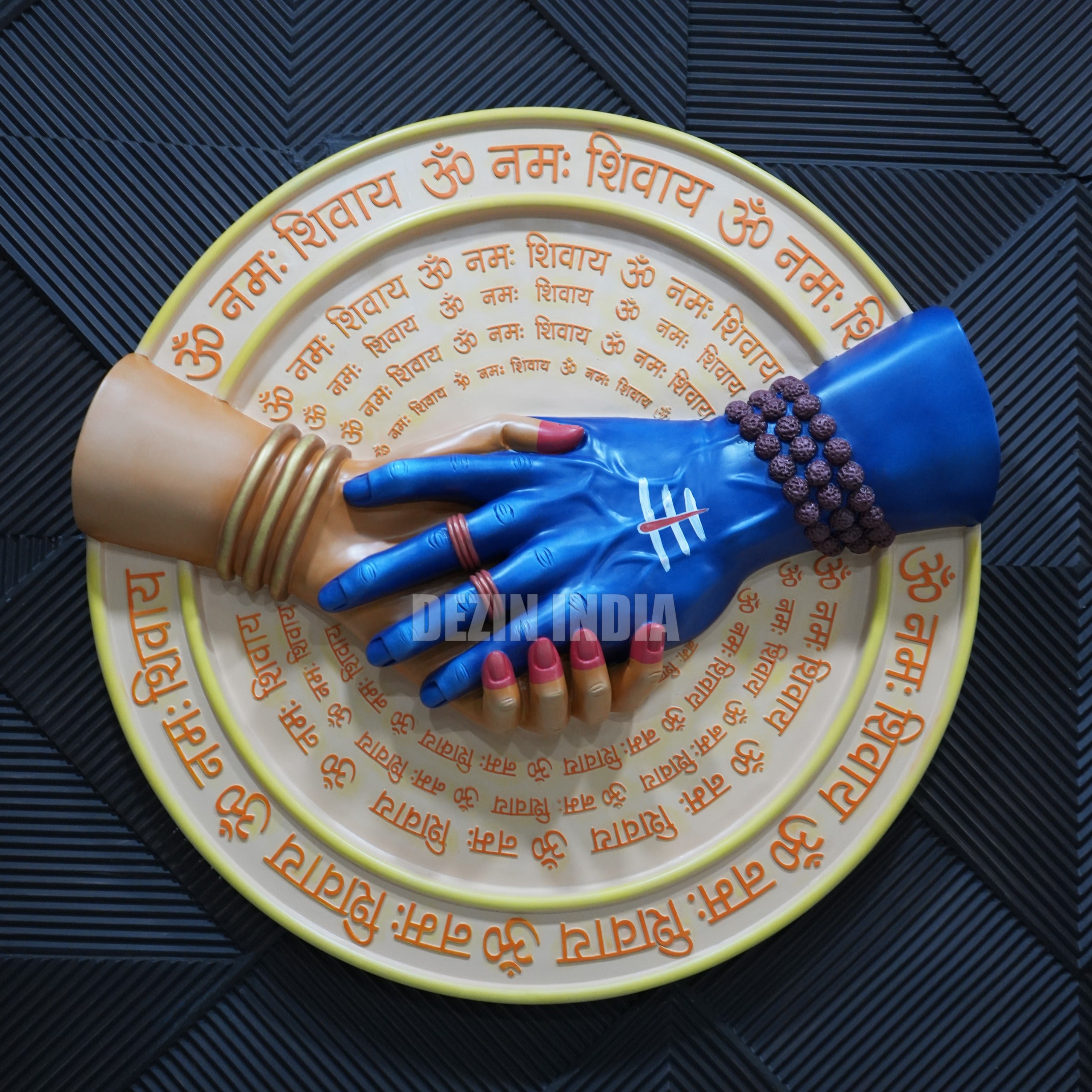 Decorative plate with hands and text on a textured surface